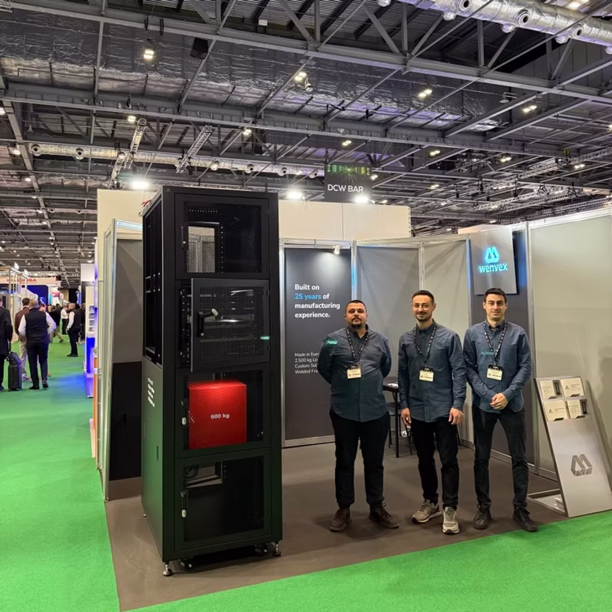 The Wenvex stand at Data Centre World London 2026, with the team beside the welded 48U colocation cabinet.